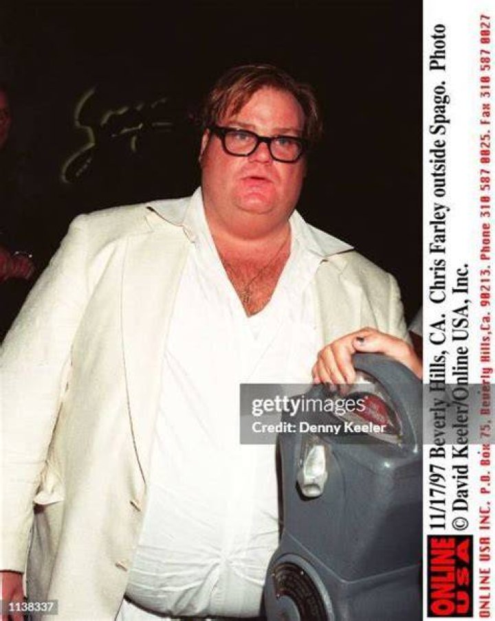 Beverly Hills, CA. Chris Farley plants a big kiss on fiancee Dixie