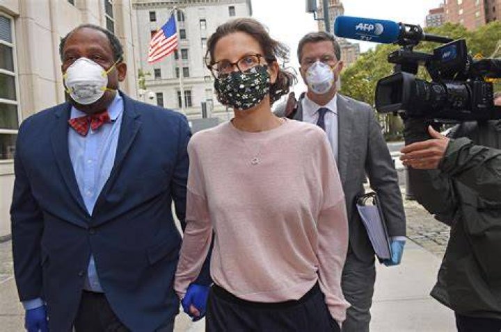 Clare Bronfman arrives at federal court, Wednesday, Sept. 30, 2020, in the Brooklyn borough of New York. Bronfman, the Seagram's liquor fortune heir and a wealthy benefactor of Keith Raniere, the disgraced leader of a self-improvement group NXIVM in upstate New York convicted of turning women into sex slaves who were branded with his initials, faces sentencing Wednesday in the federal conspiracy case. (AP Photo/John Minchillo)