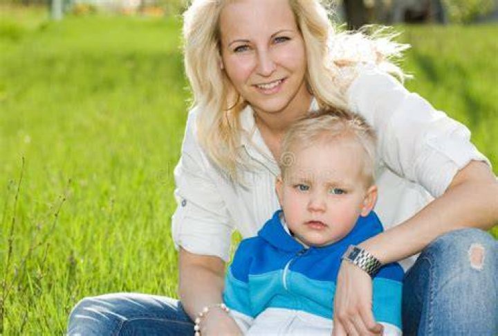 Cute Kid with His Mom Outdoors in Nature. Stock Photo Image of cute