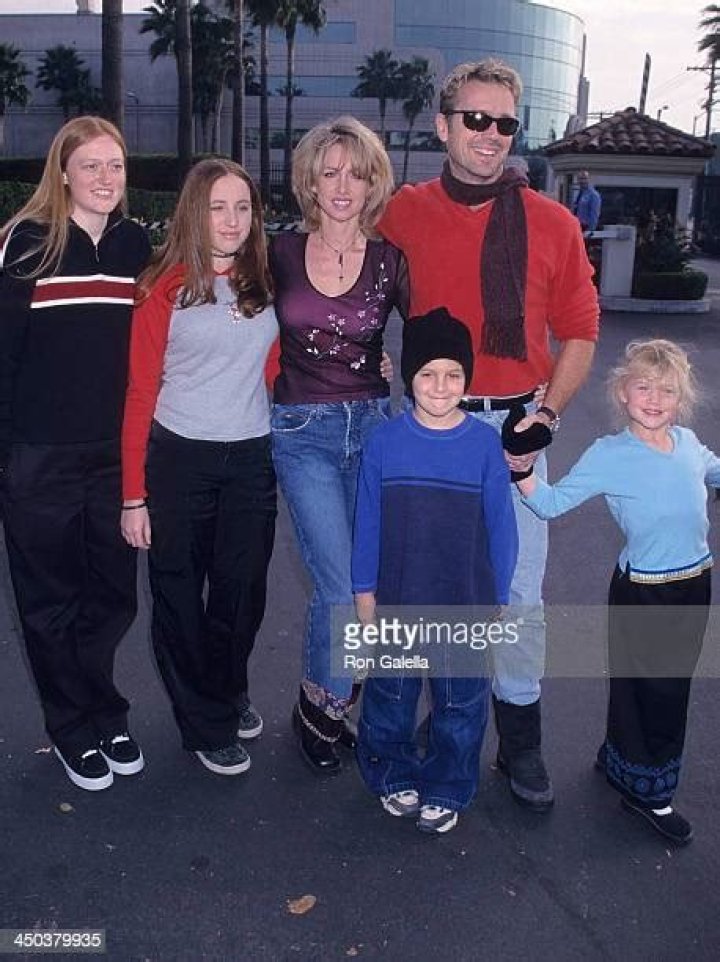 Did John Schneider have children? How many biological children does