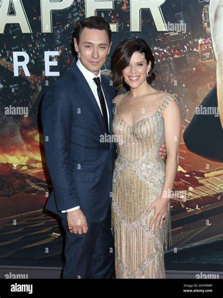 Neve Campbell & Husband JJ Feild attending the Derren Brown Secret