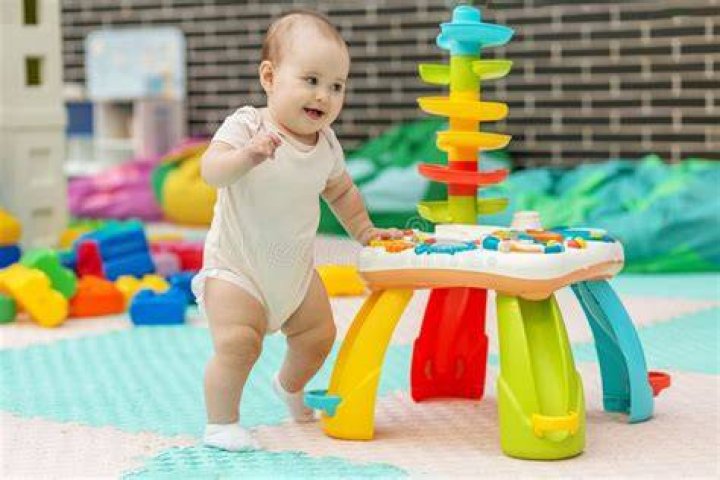 Toddler's Hilarious Response When Mom Finds Him Washing Dishes Goes Viral