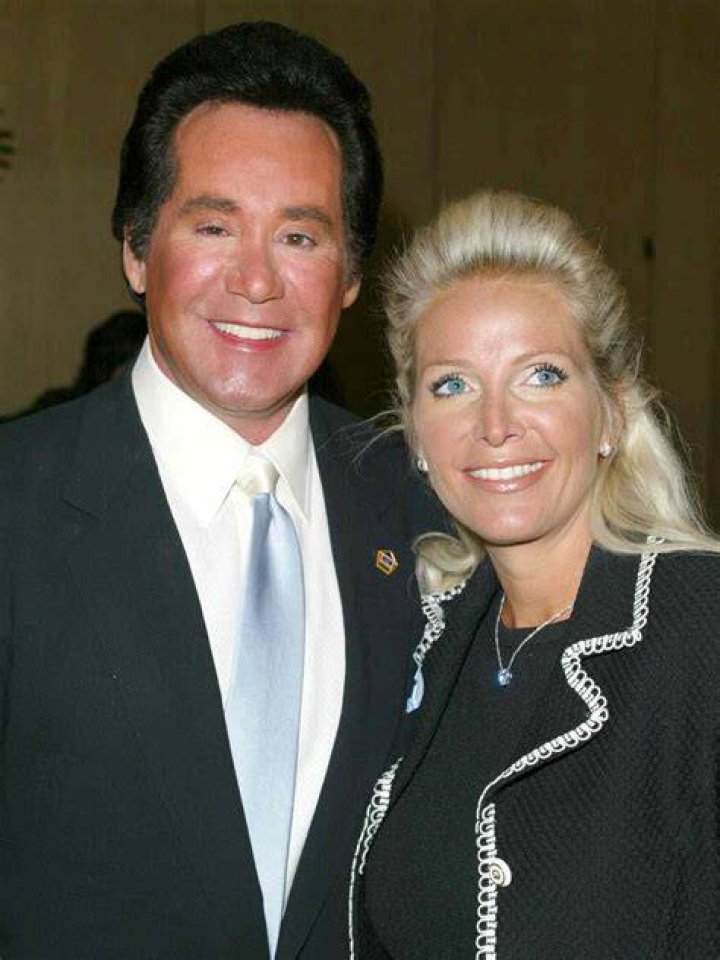 Wayne Newton and his wife Kat Newton holding their newborn son, Carson