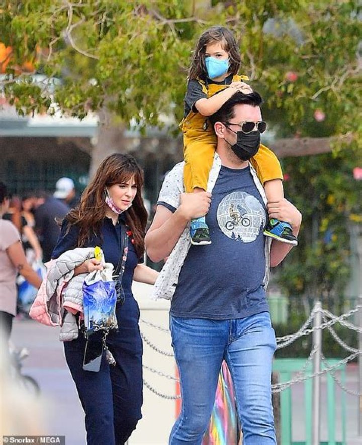 Zooey Deschanel spends the day at Disneyland with her kids and